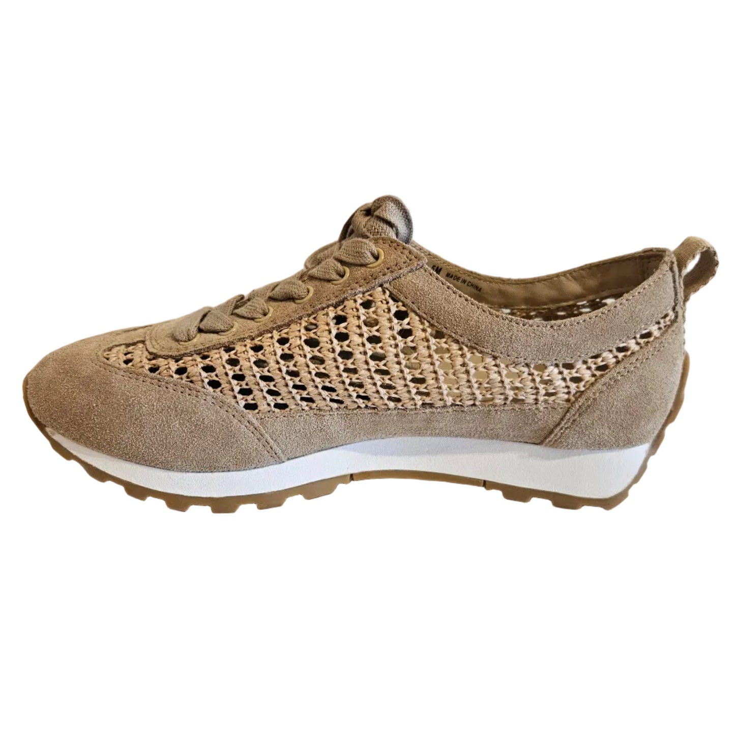 Beige sneaker with a textured pattern on a white surface