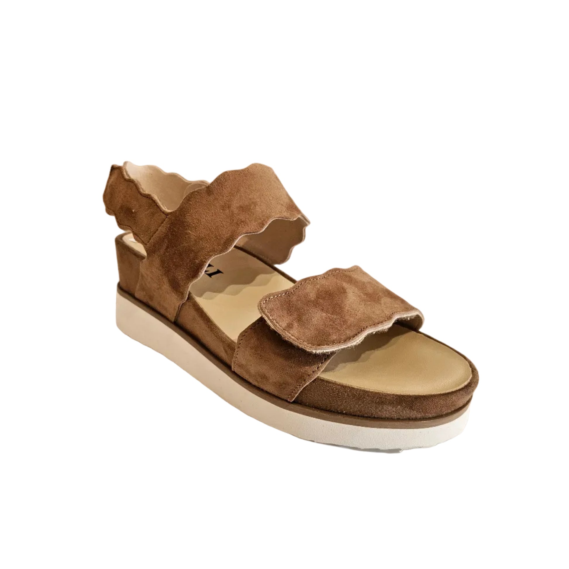 Brown sandal with white sole on a light gray background