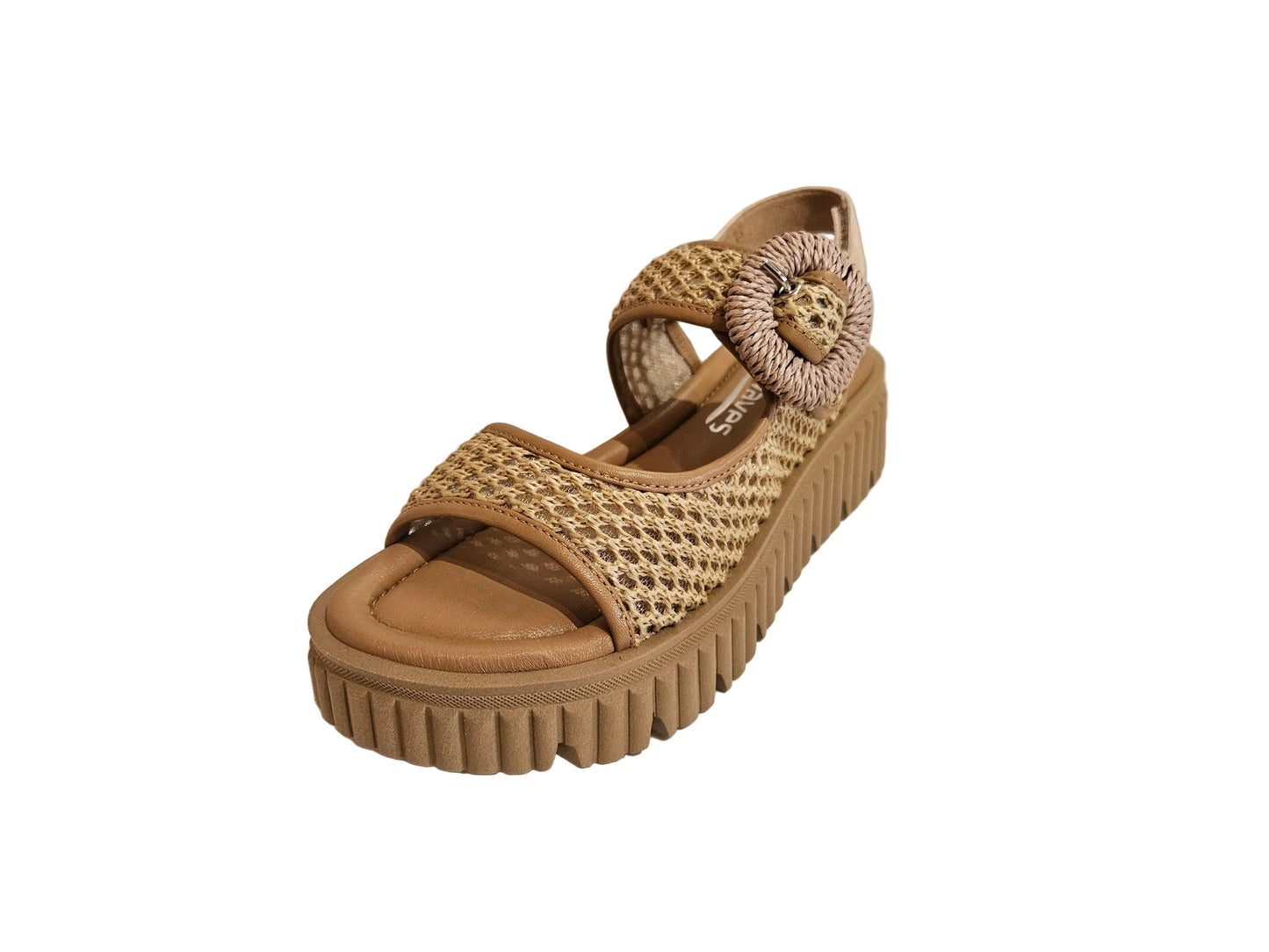 Tan wedge sandal with woven design on a white surface