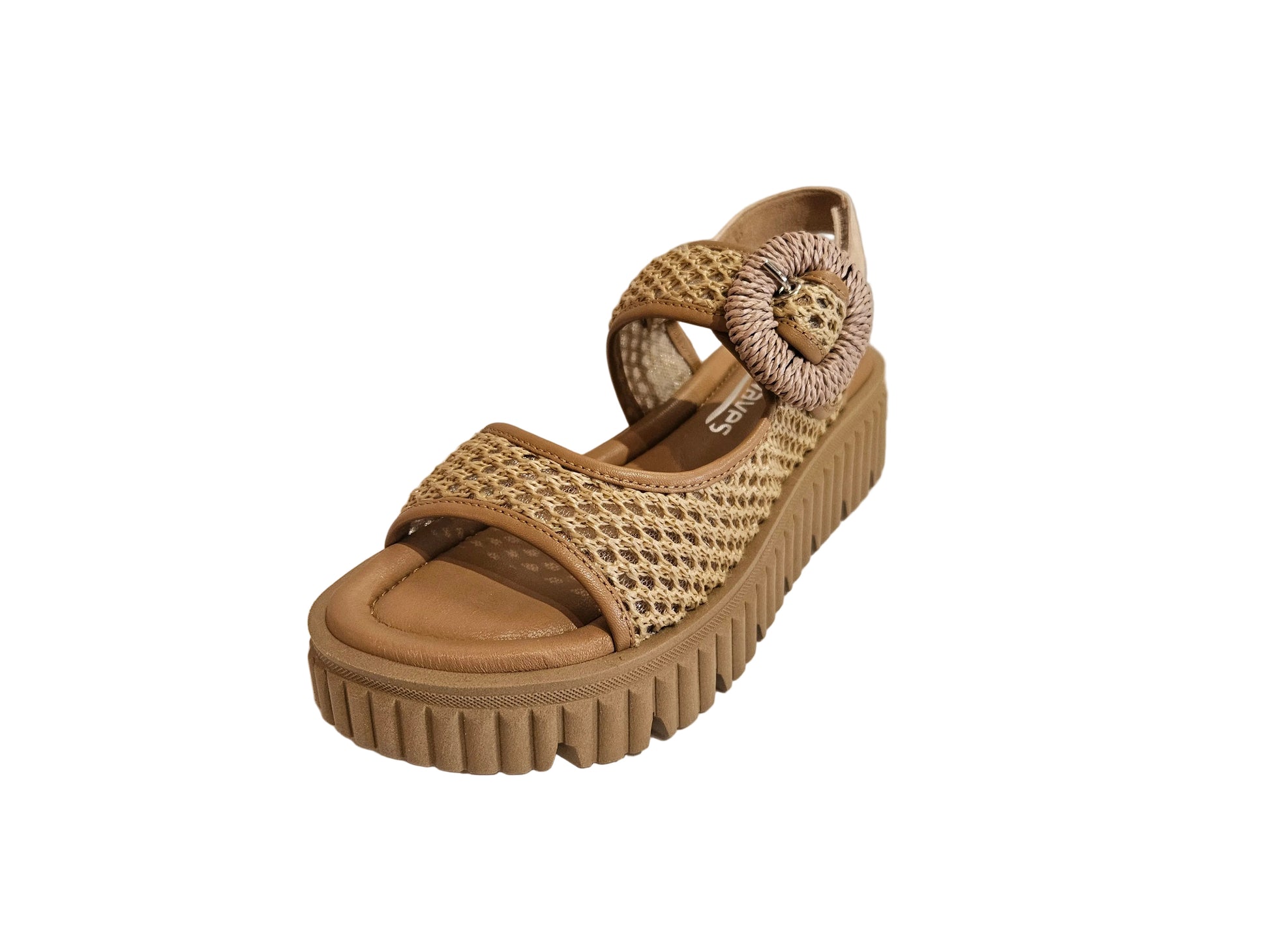 Tan wedge sandal with woven design on a white surface